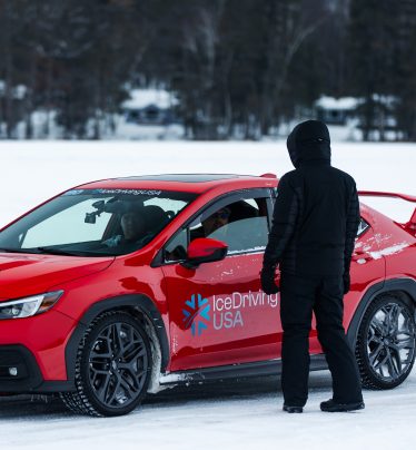 Ice driving car lineup on lake